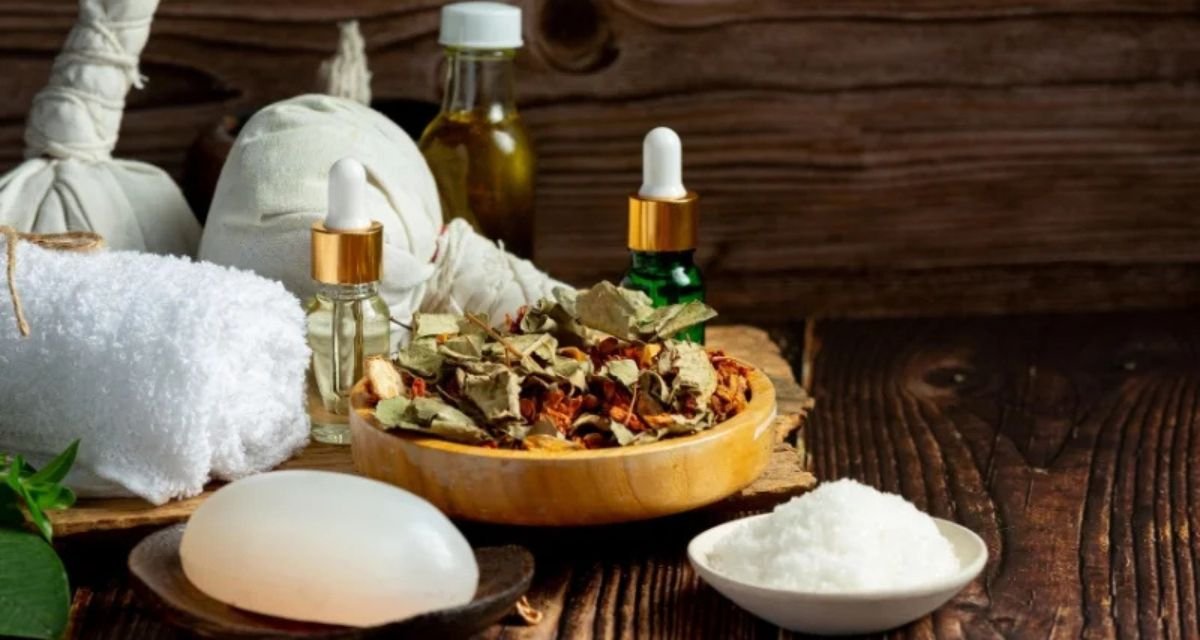 Therapist performing traditional Ayurvedic oil massage